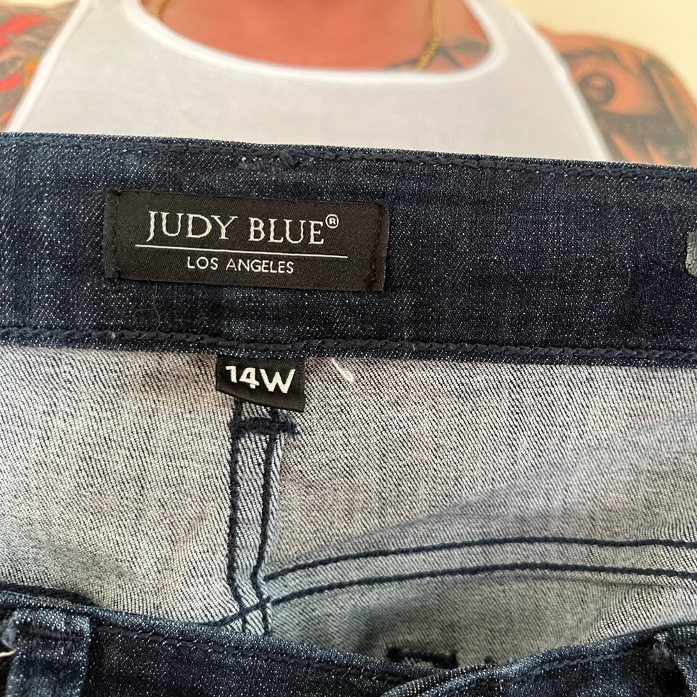 Judy blue, dark blue shark bite jeans.